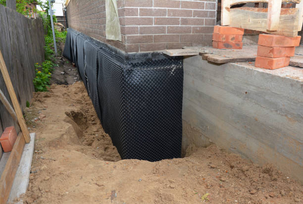 SJ Waterproofing Pros technician performing targeted Wet Basement Repair assessment in Amlin, OH